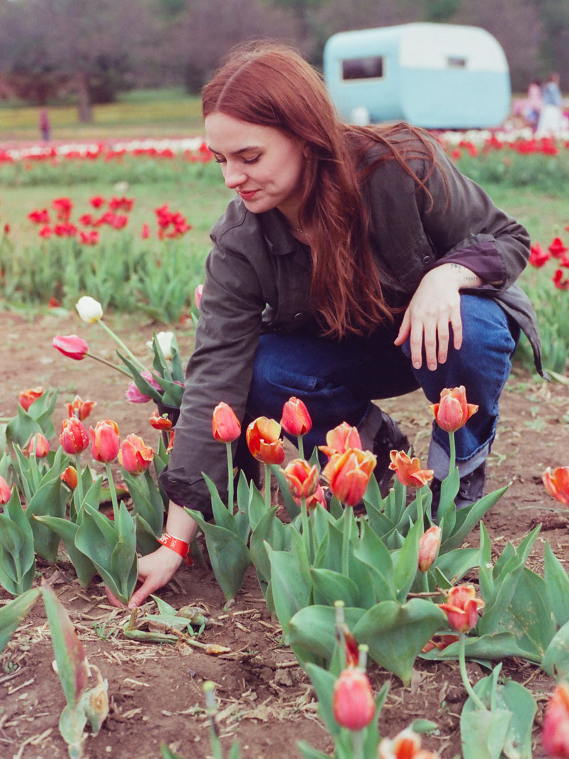 A photo of Abby in a tulip garden