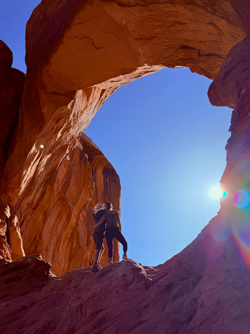 A photo of Cammy and a friend at Arches National Park