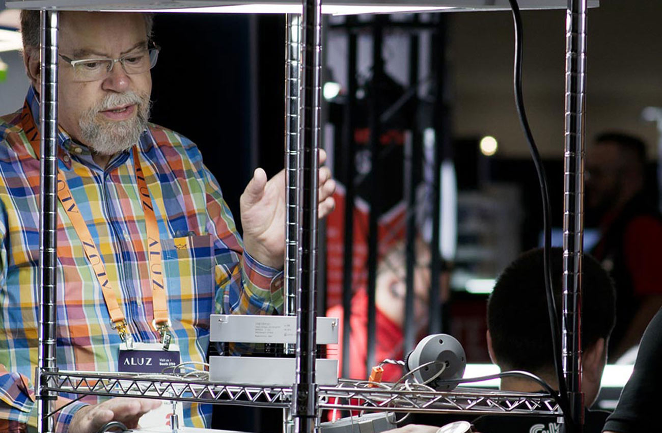 A man presents lighting products at Lightfair