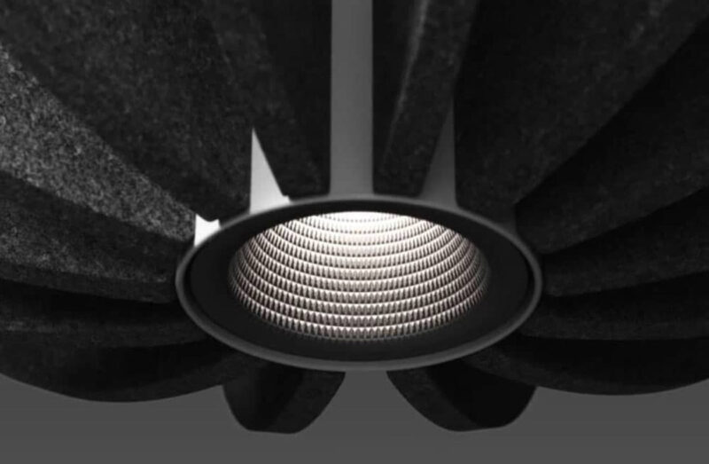 A close-up rendering of a black OCL Kwyet acoustic fixture from the product launch video