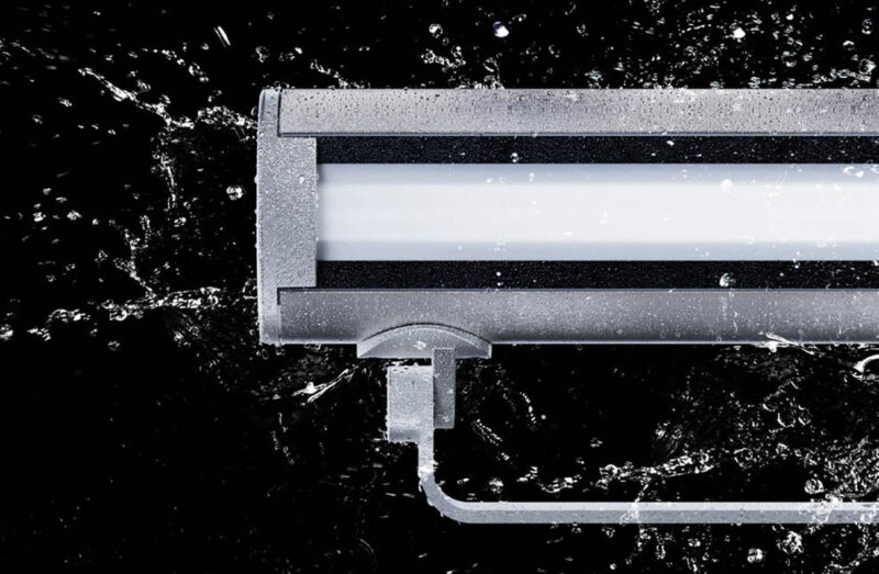 Vista 1050 Linear Series Launch A rendering of a Vista 1050 Linear Series lighting product getting splashed with water
