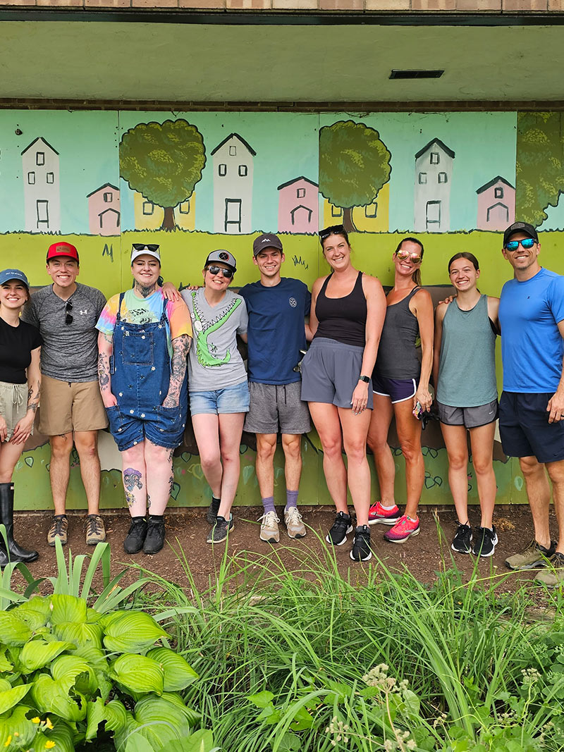 YLB Philanthropy - YLB team members stand outside of Franklinton Farms after a volunteer session
