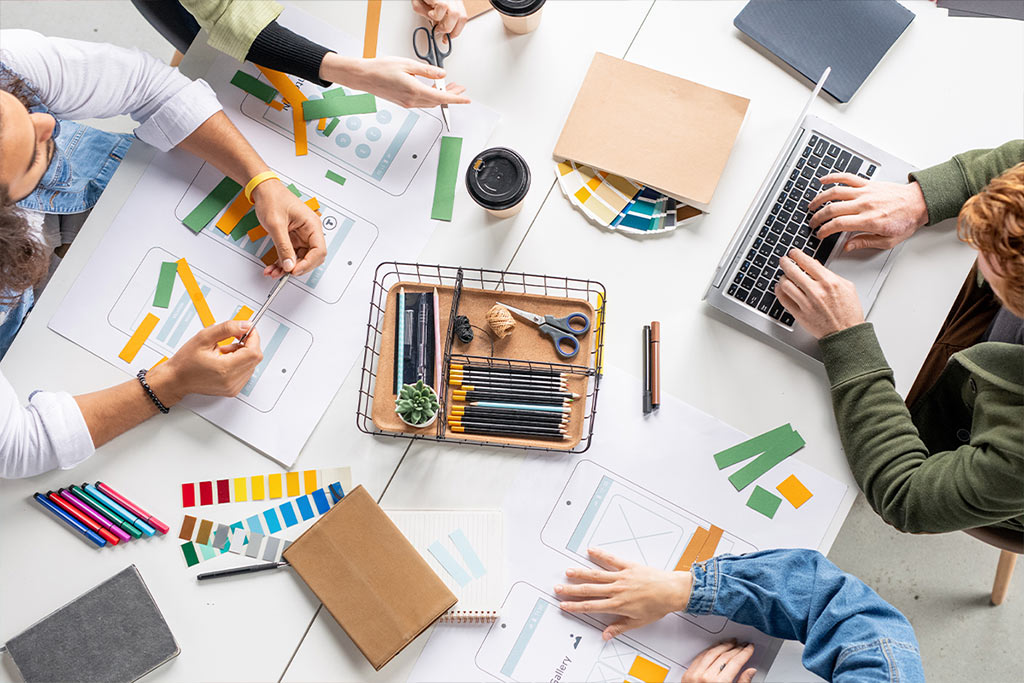 A group of designers discuss brand strategy